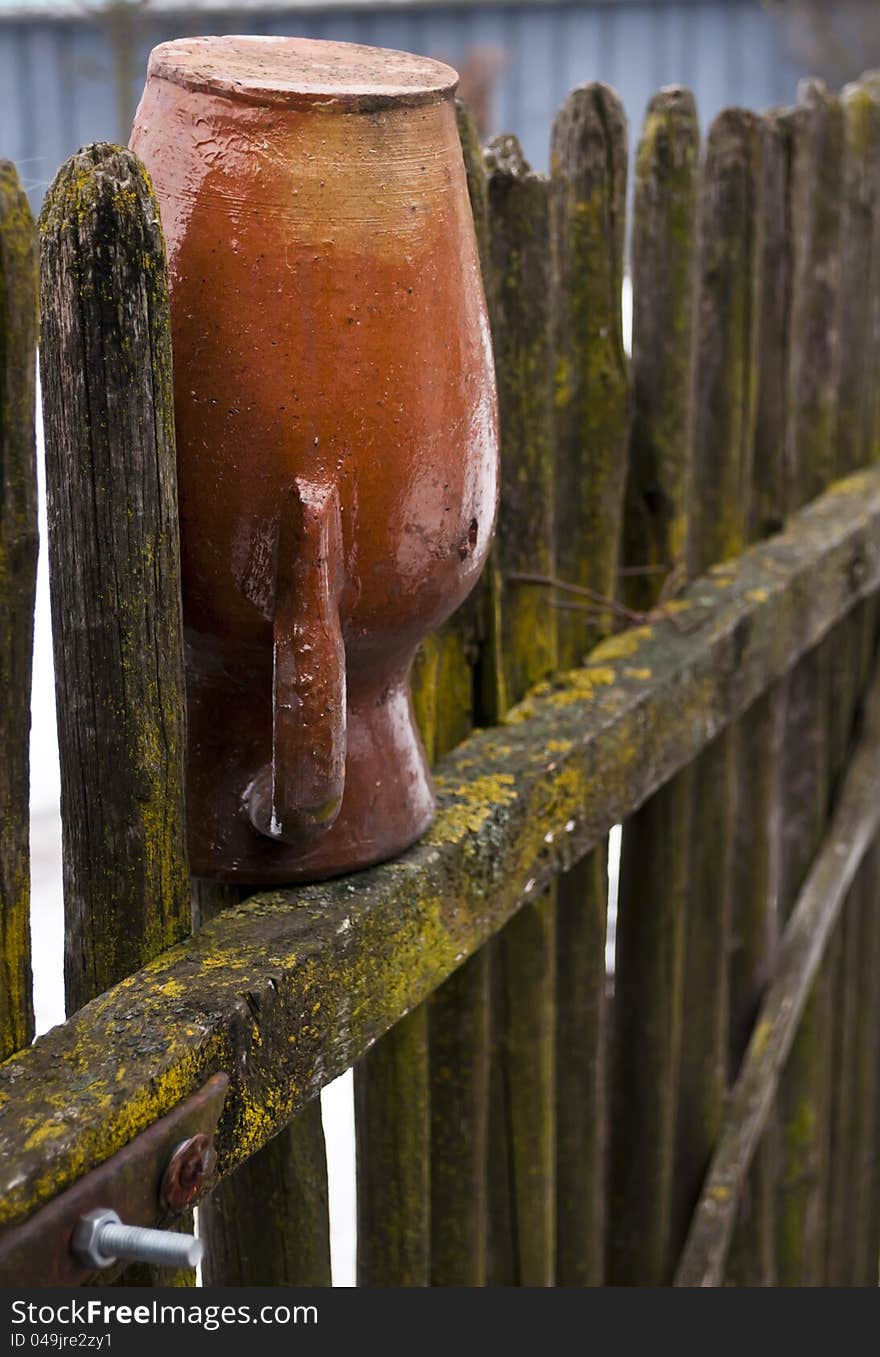 Old Pottery in fence in winter time.