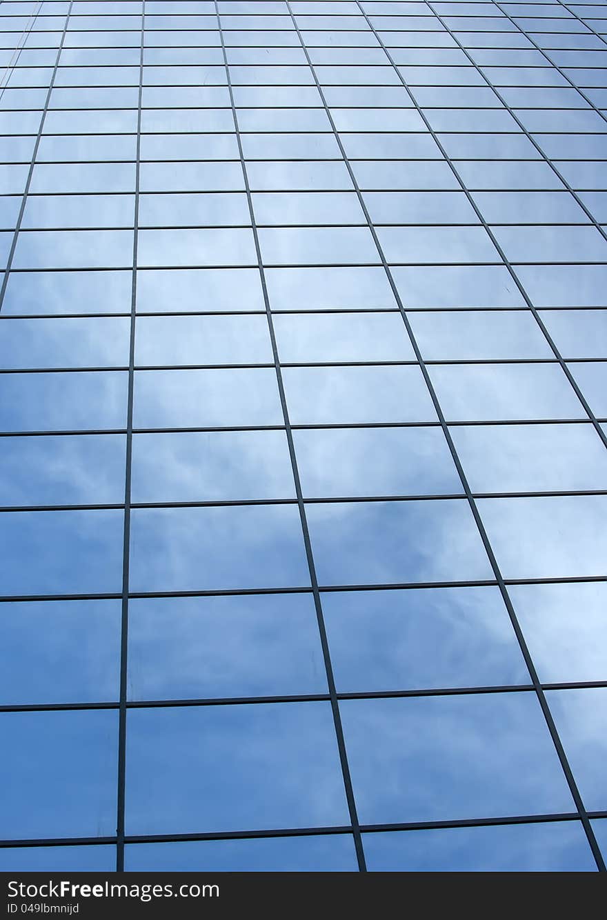 Modern office building with blue square windows.