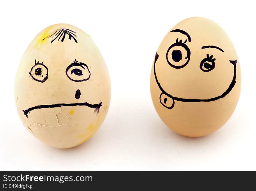 Happy and sad eggs with faces isolated on white