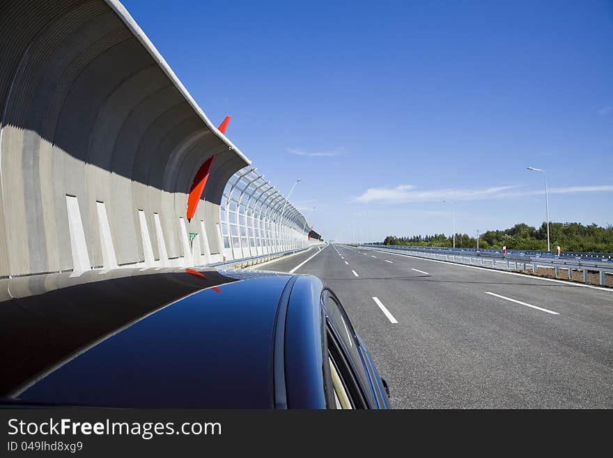 Empty highway with sound protection walls and car. Empty highway with sound protection walls and car