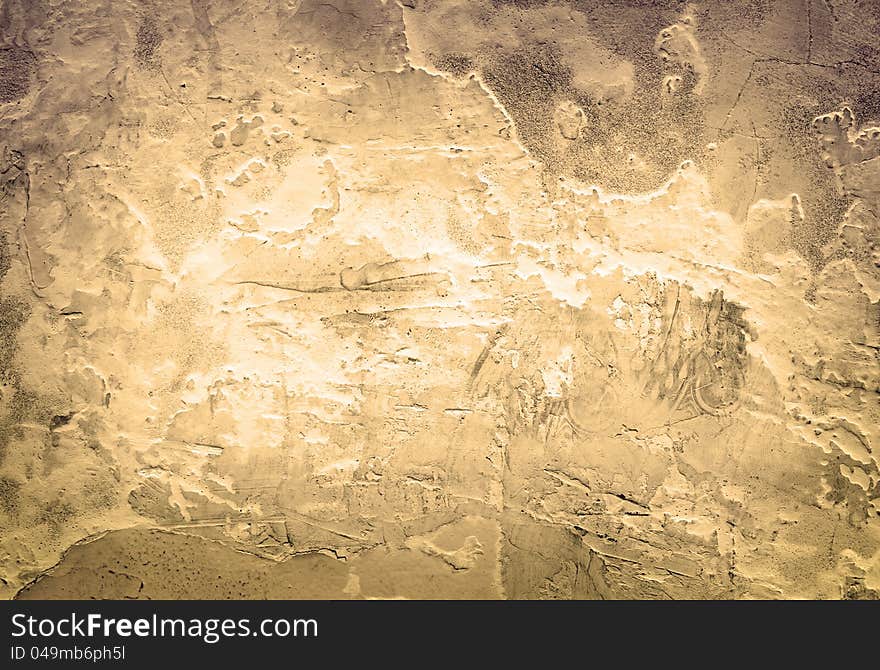 Toned vintage background of closeup fragment of grunge weathered stone wall. Toned vintage background of closeup fragment of grunge weathered stone wall