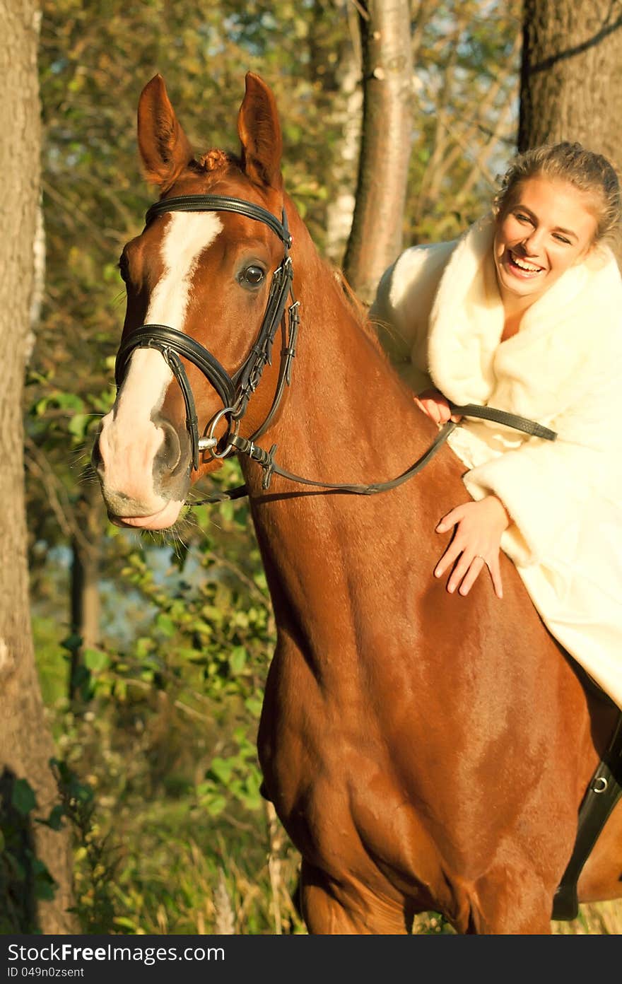 Bride ride on red  horse in forest