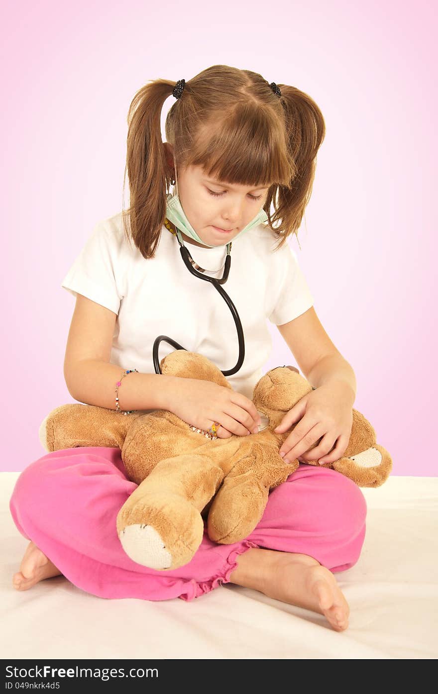 Girl doctor with teddy bear. Girl doctor with teddy bear