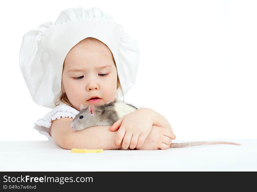 Little girl embracing domestic rat on white background