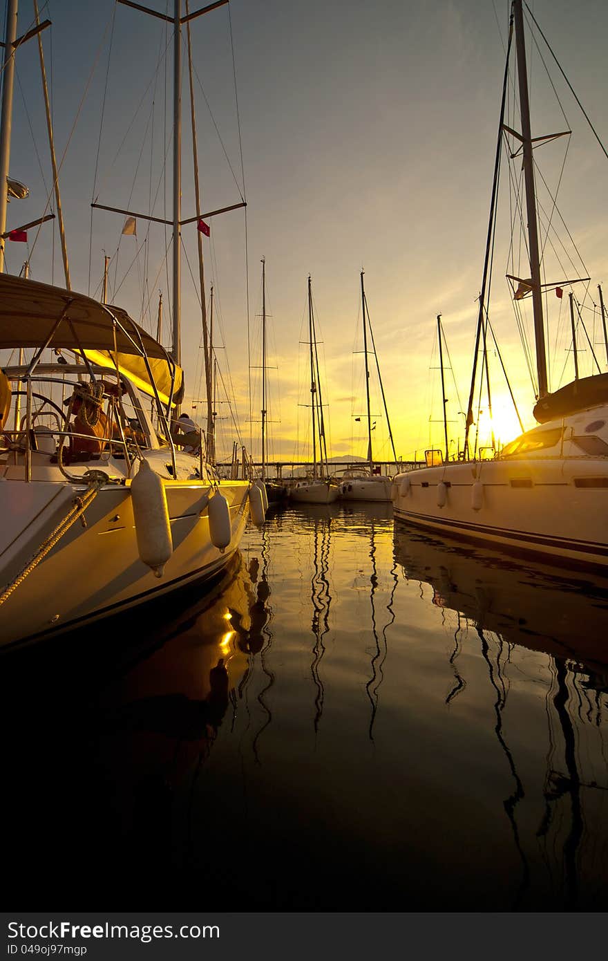 Yachts at a wharf in the evening