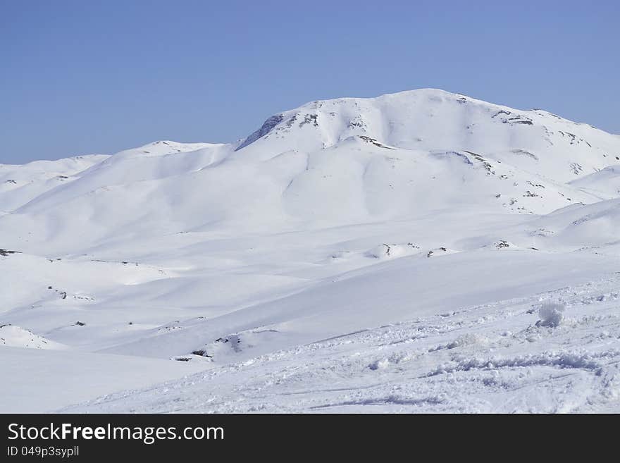 High mountain in winter on sunny day