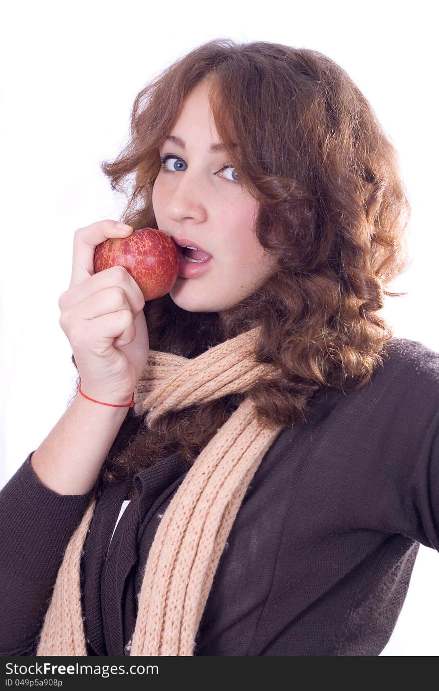 Young beautiful girl bites an apple isolated. Young beautiful girl bites an apple isolated