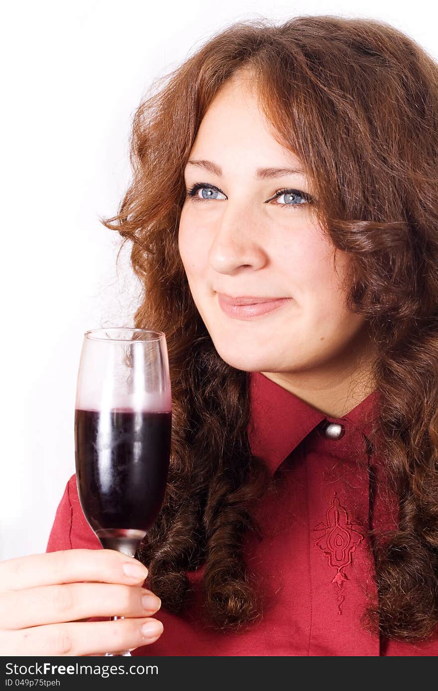 Closeup of beautiful female lips drinking wine from a glass with dewdrops on it.