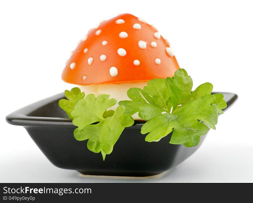 Fly mushroom formed from boiled egg, cover with the tomato mayonnaise. Funny food for children or party.