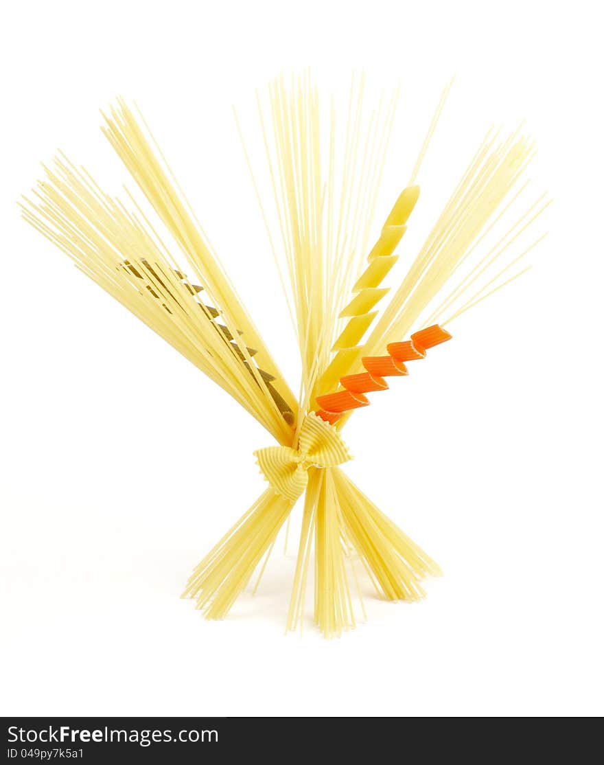 Bunch of spaghetti with color fusilli isolated on white background