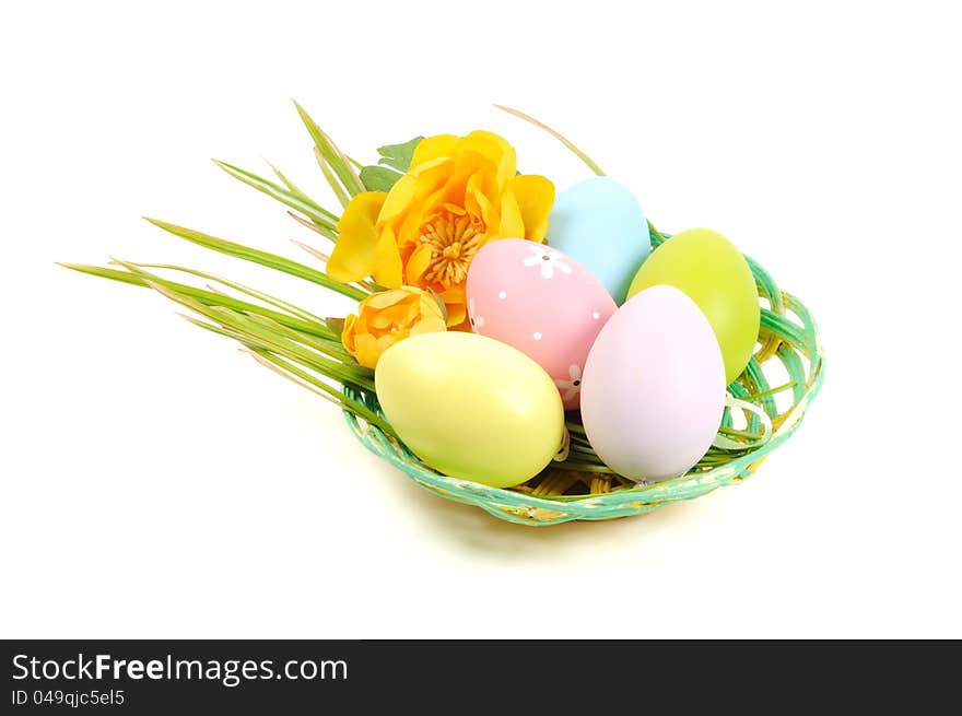 Colorful painted Easter eggs in a wooden plate, white background