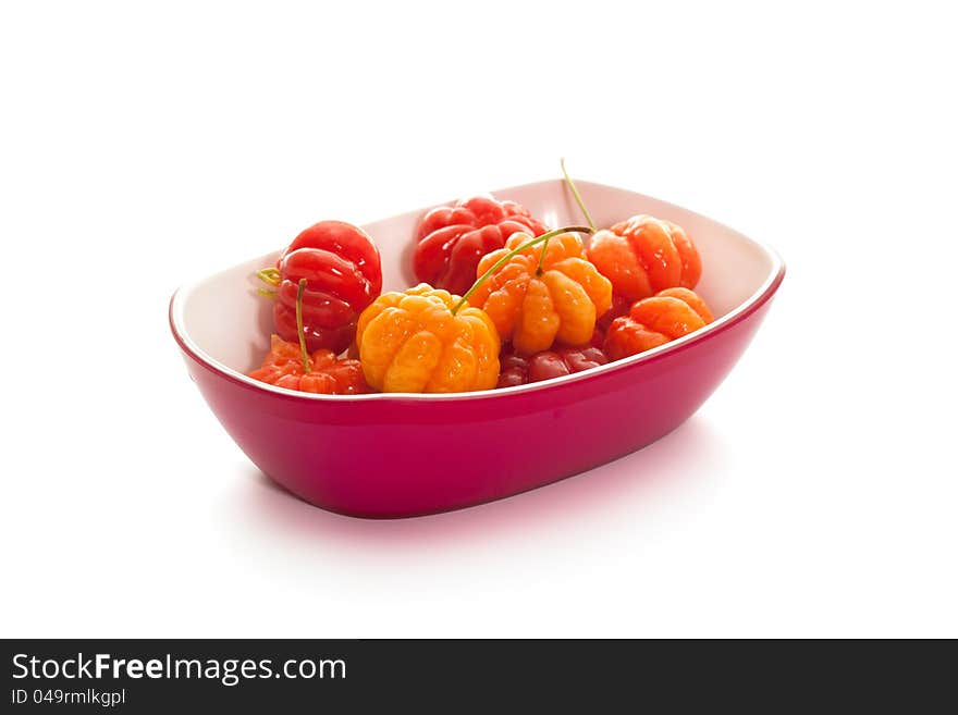 Star gooseberry in magenta bowl on white background. Star gooseberry in magenta bowl on white background