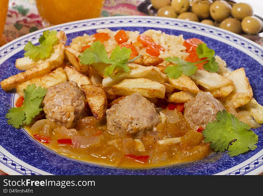 Meat balls with rice and potatoes