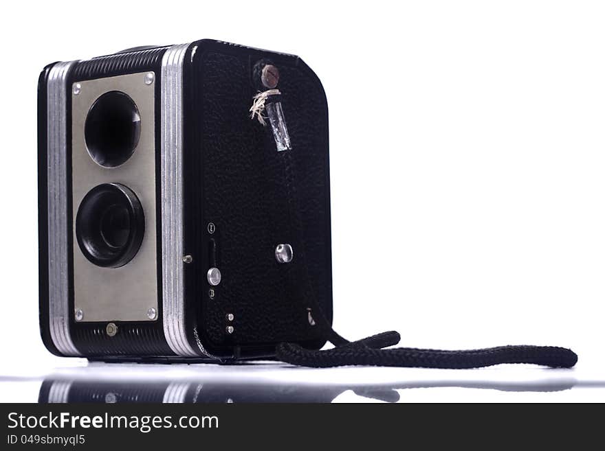 Close view of a vintage dual lenses reflex camera isolated on a white background. Close view of a vintage dual lenses reflex camera isolated on a white background.