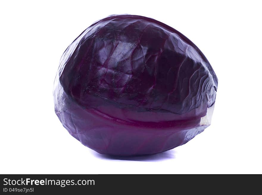 Close view of a red cabbage isolated on a white background.