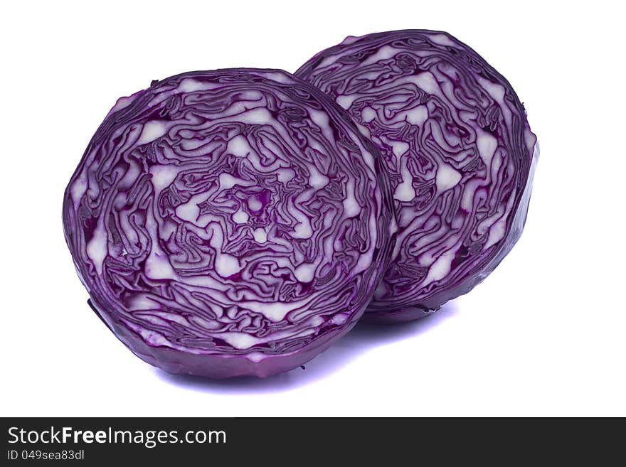 Close view of a sliced red cabbage isolated on a white background.