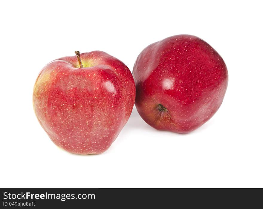 Two red apples on a white background