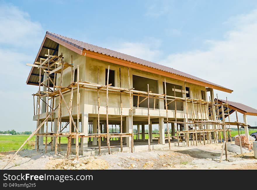 A new home under construction with sky background