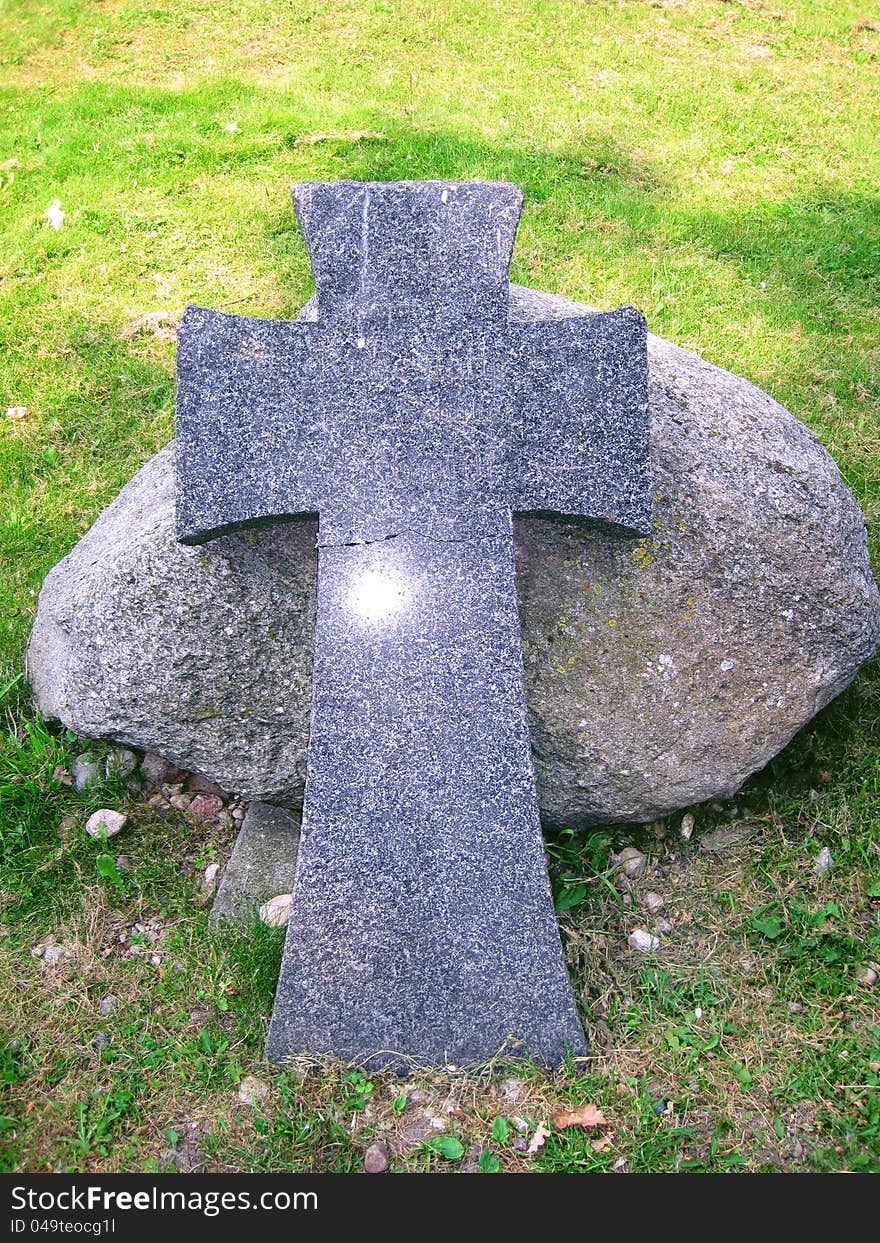 Stone cross and a large stone