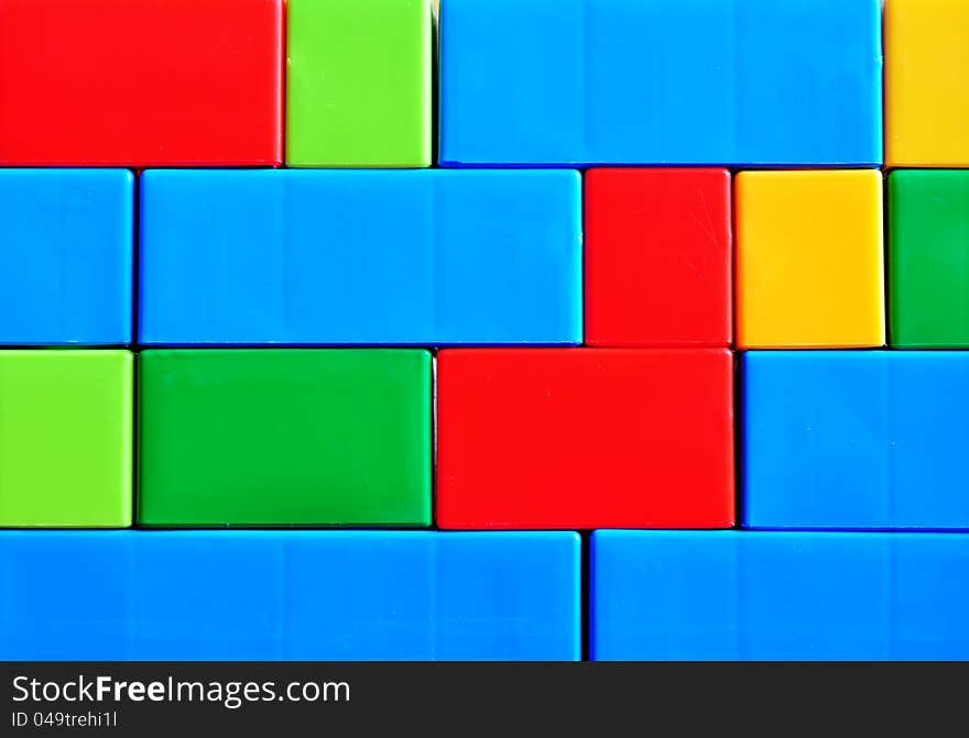 Colorful brick wall, plastic structure, background.