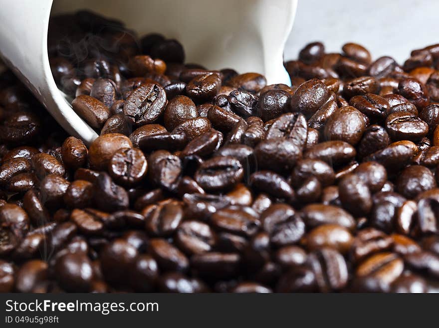 Coffe and a cup with smoke as background