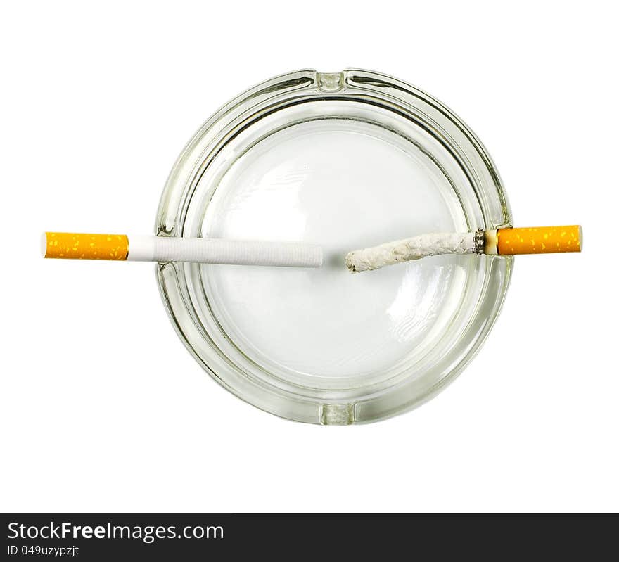 Cigarette in ashtray concept on white background