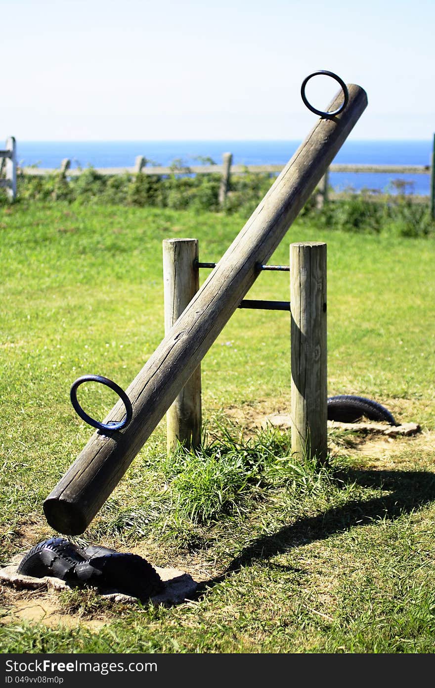 Equipment in a children's play park grass. Equipment in a children's play park grass