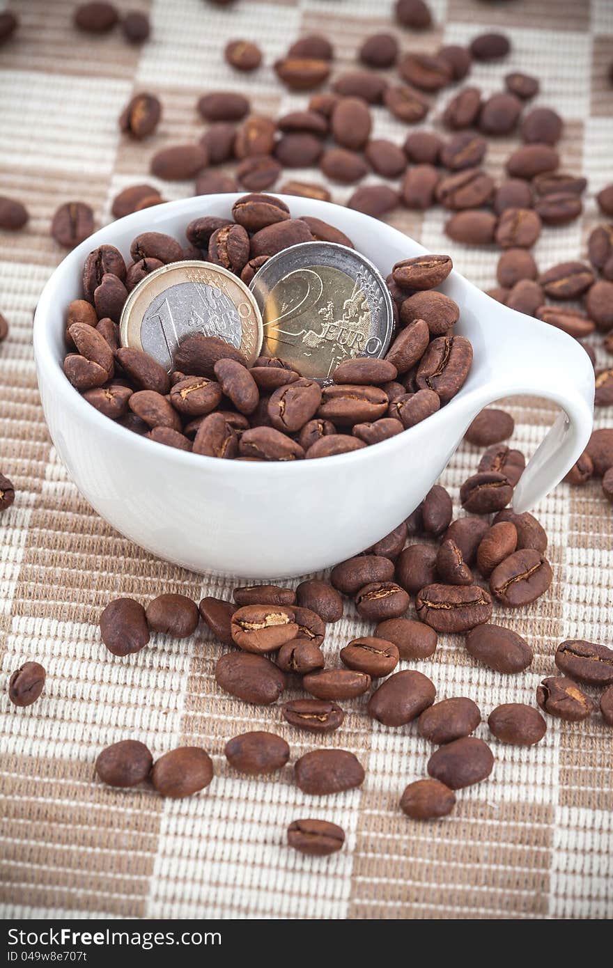 Ceramic Cup With Coffee Seed And Euro Coins