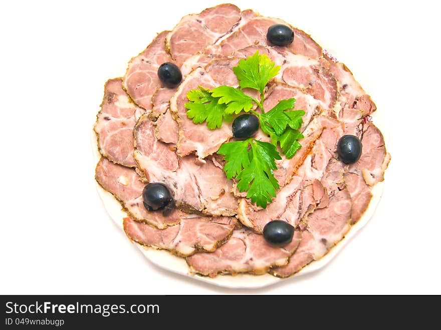 Meat with herbs on a plate on white