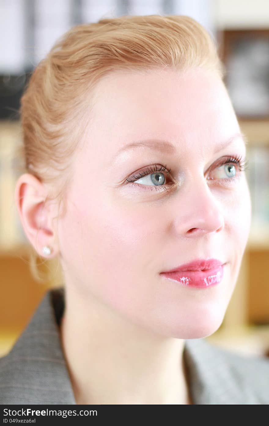 Close-up portrait of young woman's face in an office