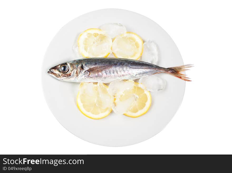 Mackerel in the bowl with the lemon. On a white background.