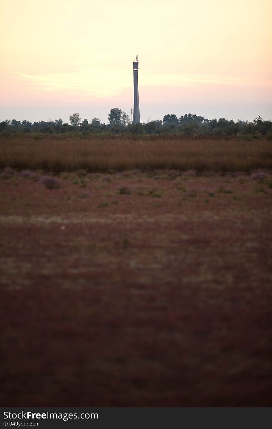 Lighthouse in deserted landscape