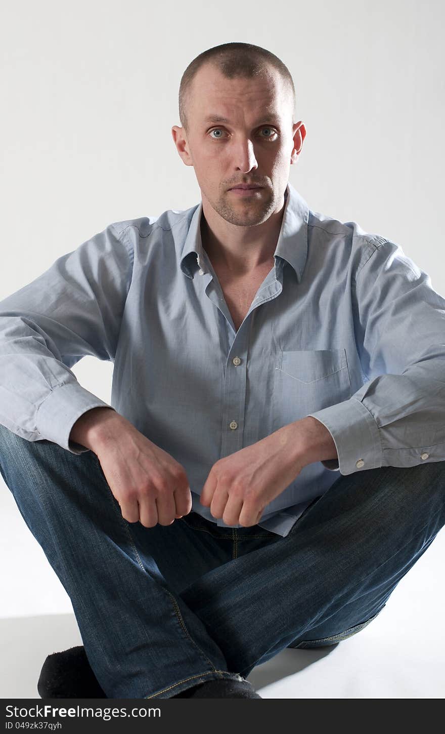 Portrait of serious young man in shirt. Portrait of serious young man in shirt