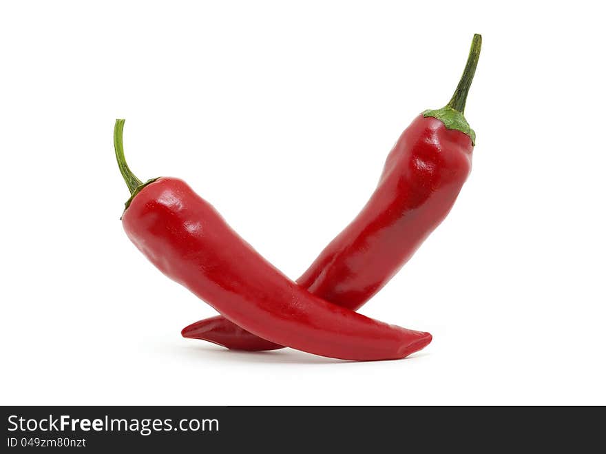 Fresh red hot pepper on a white