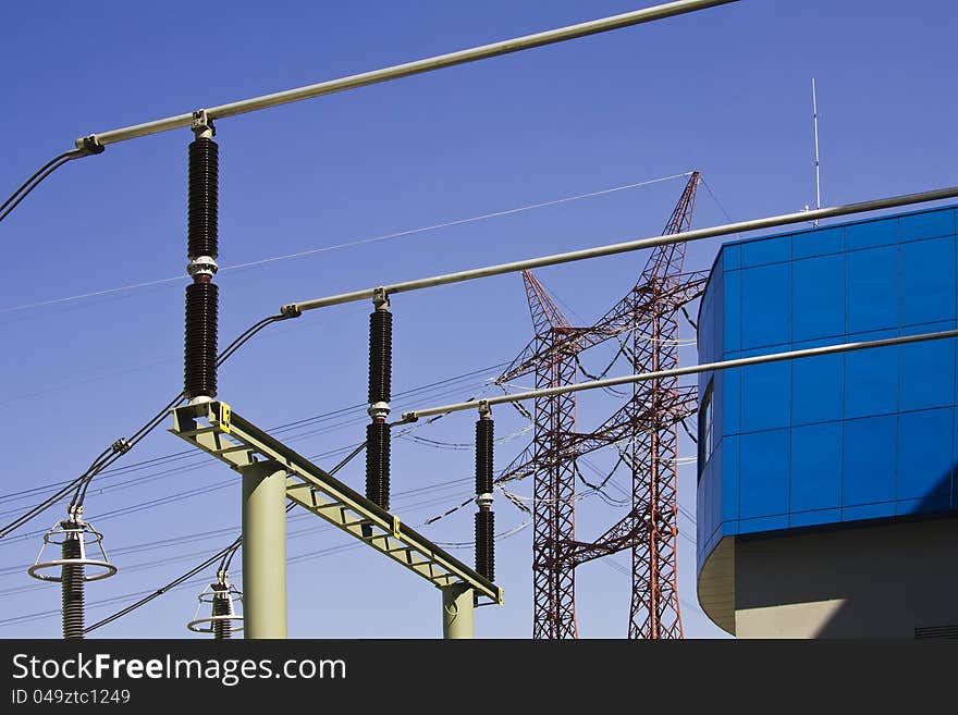 High voltage power isolators and power pylon against blue sky