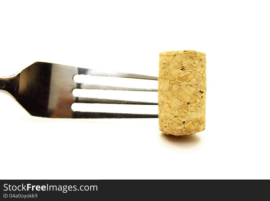 Fork and cork on white background