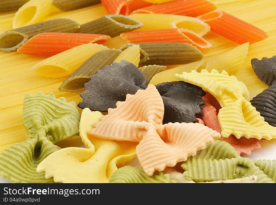 Italian pasta spaghetti, Penne rigate tricolore and farfalle as background. Italian pasta spaghetti, Penne rigate tricolore and farfalle as background