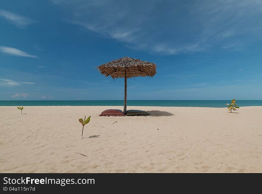 Umbrella and beautiful beach on a sunny day