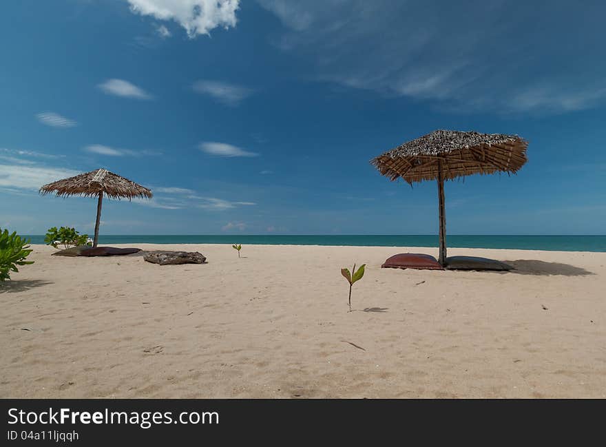 Umbrella and beautiful beach on a sunny day