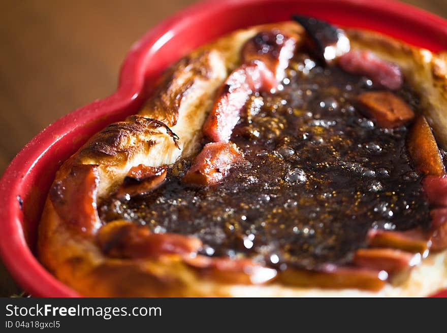 Pieces of jam strawberry pie in table