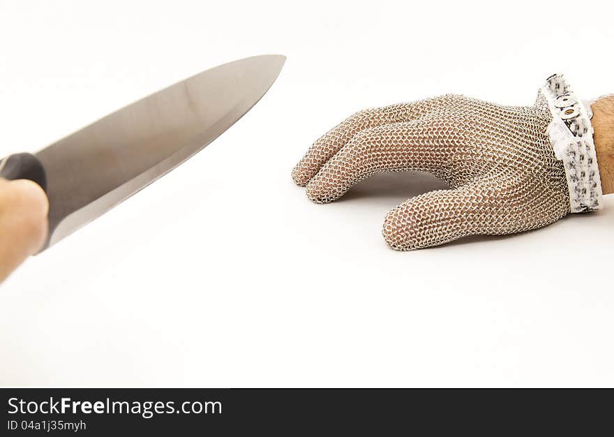 Hand of a worker with a mesh glove anticut. Hand of a worker with a mesh glove anticut