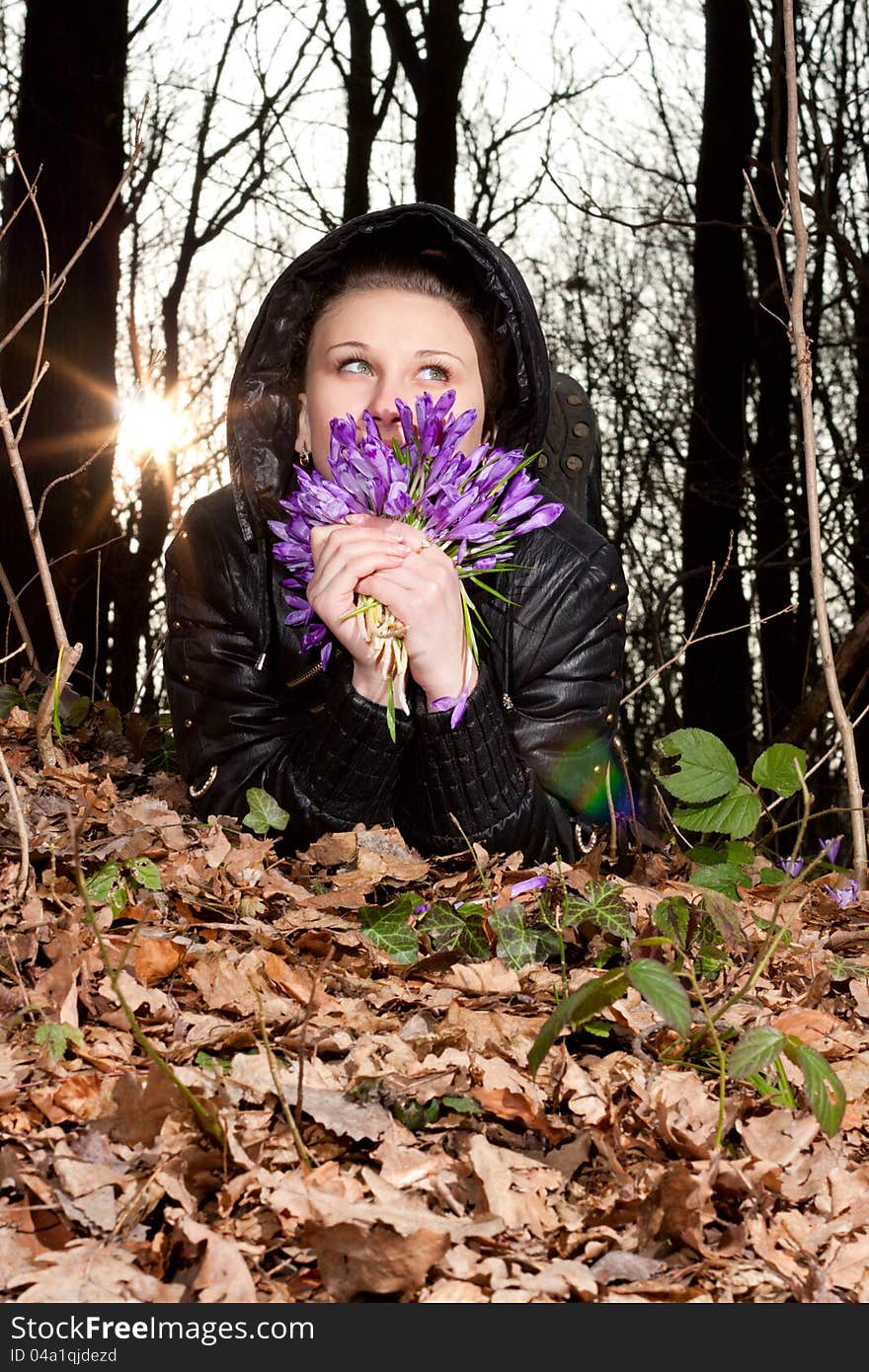 Girl with snowdrops in the hands of