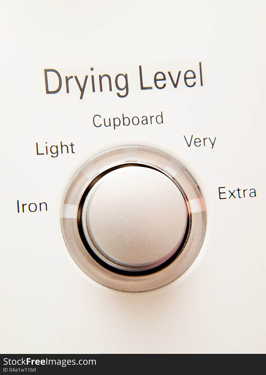 Program button with selections on a dryer machine. Program button with selections on a dryer machine