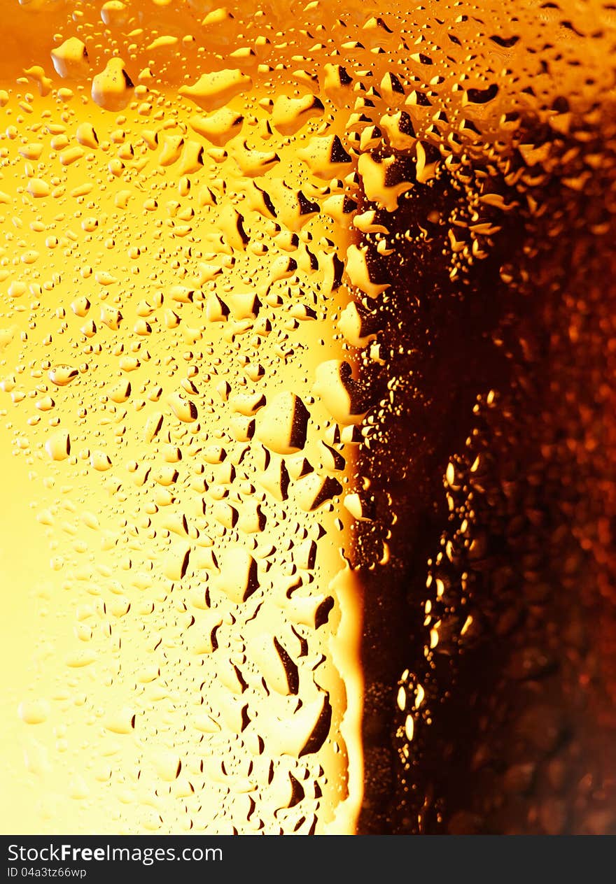 Close-up picture of a golden bubbles of a beer on the glass. Close-up picture of a golden bubbles of a beer on the glass.