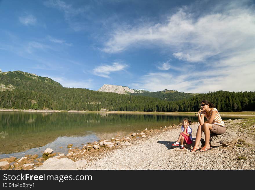 Woman and girl near Crno lake in National Durmitor Park. Woman and girl near Crno lake in National Durmitor Park