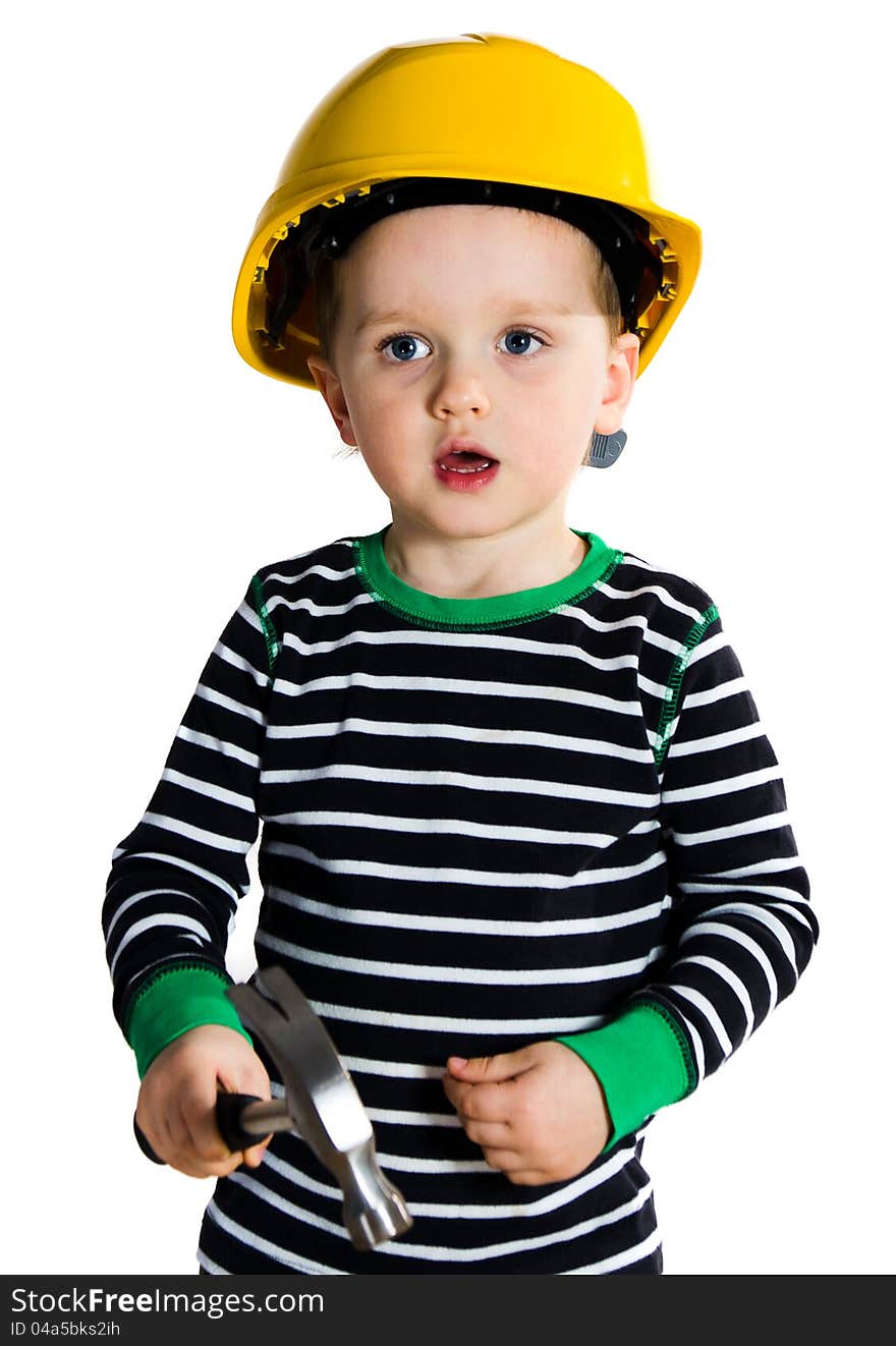 Funny little boy in yellow helmet playing with hammer. Funny little boy in yellow helmet playing with hammer