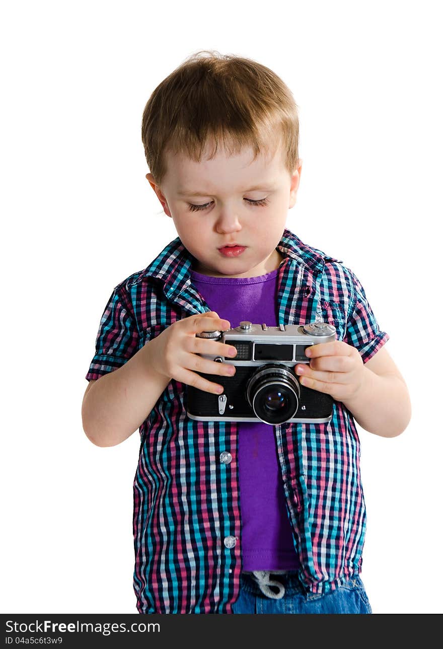 Boy playing with retro analogue photo camera - isolated on white background. Boy playing with retro analogue photo camera - isolated on white background