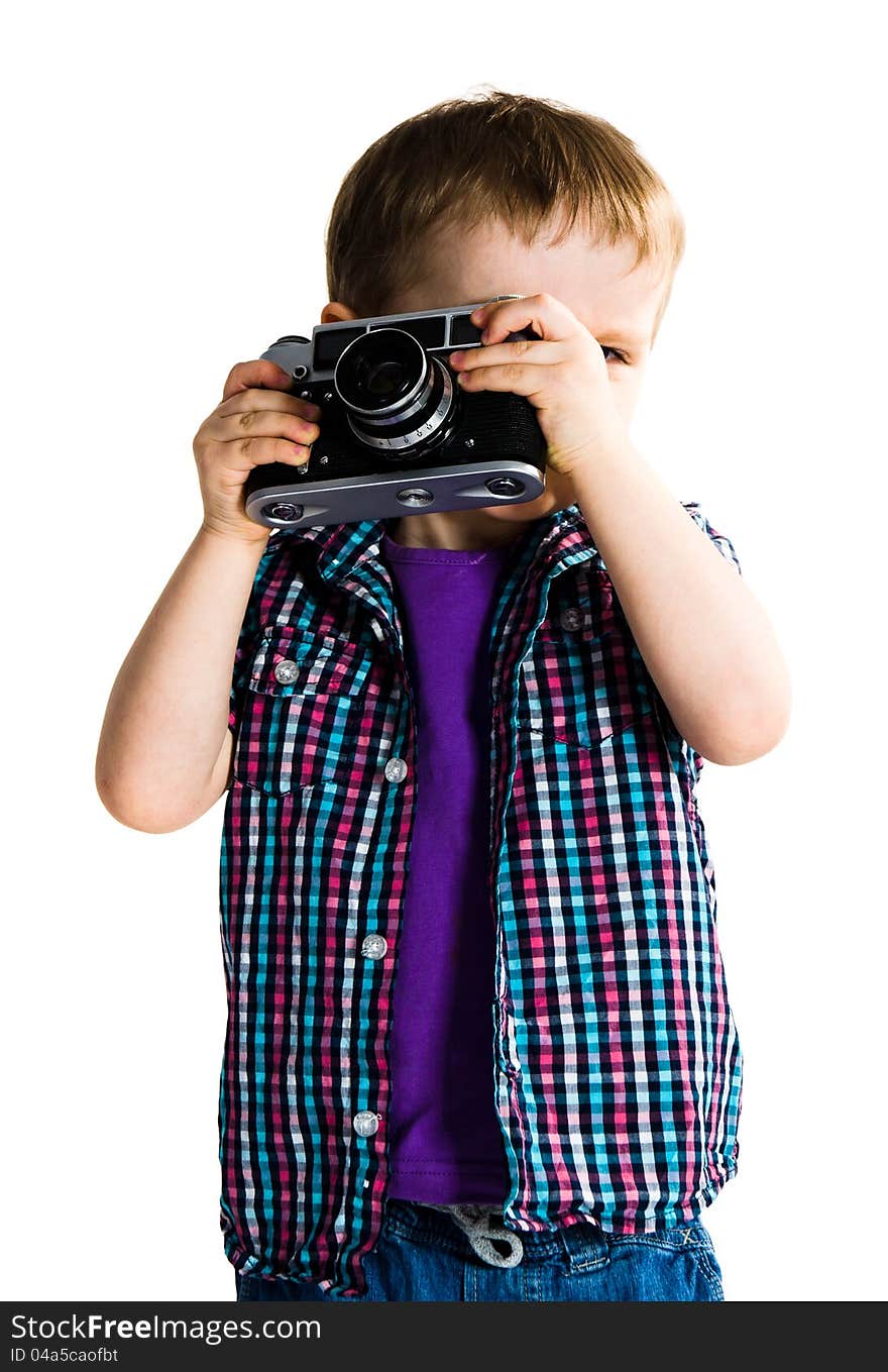 Cute child playing with retro analogue photo camera - isolated on white background. Cute child playing with retro analogue photo camera - isolated on white background