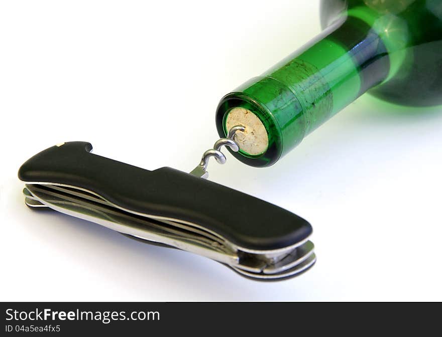 Bottle of vine opened by pocket knife. Bottle of vine opened by pocket knife