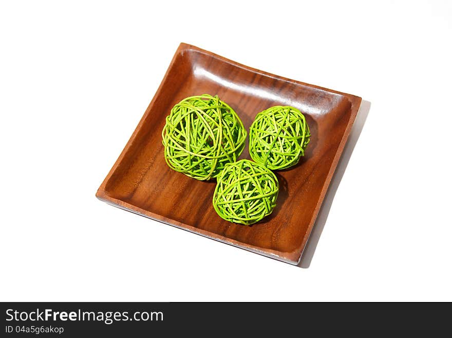 Wooden bowl with wicker balls